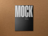 Poster/letterhead mockup on a cardboard background top view.