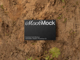 Business card mockup on an eco/ground background top view.