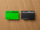 Business card mockup on a wooden background top view.