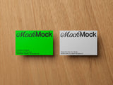 Business cards mockup on a wooden background top view.