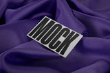 Business card mockup on a fabric background top view.