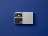 Business card mockup on a paper background top view.