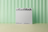 Square card mockup on a corrugated plastic background top view.