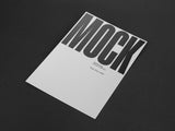 Poster/letterhead mockup on a black paper background top view.