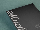 Poster/letterhead mockup on a canvas background top view.