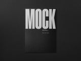 Poster/letterhead mockup on a black paper background top view.